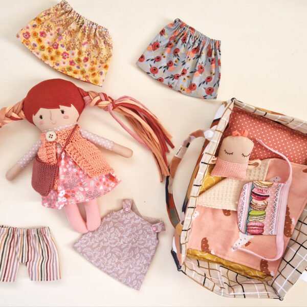 Dress up doll play set in bed
