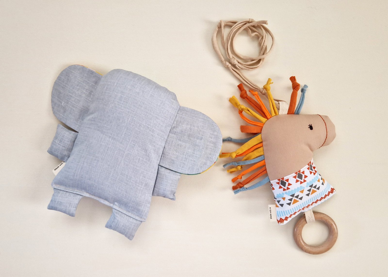 Handmade baby play set with a soft fabric elephant and horse rattle with wooden ring