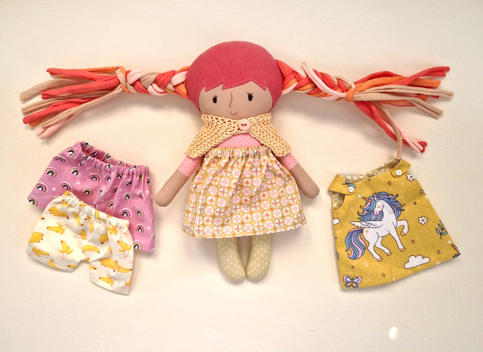 Colorful fabric doll with an interchangeable dress
