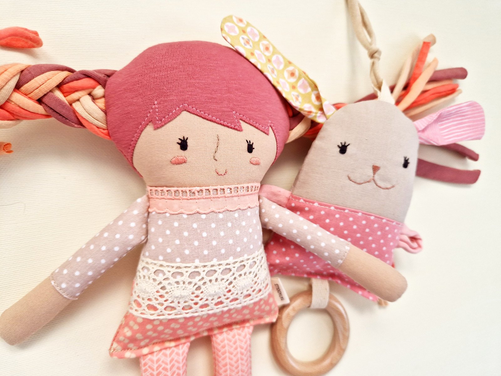 Handmade baby play set with a soft fabric doll and wooden ring rattle