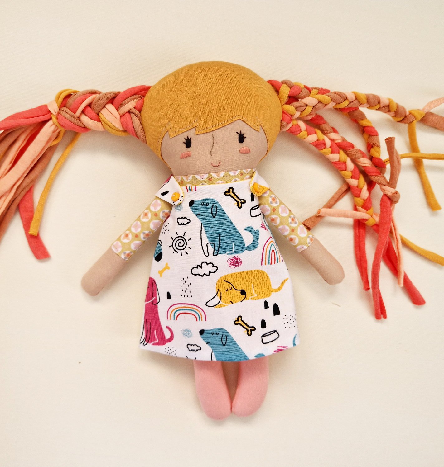 Pair of soft fabric play dolls featuring a larger doll and a small baby doll.