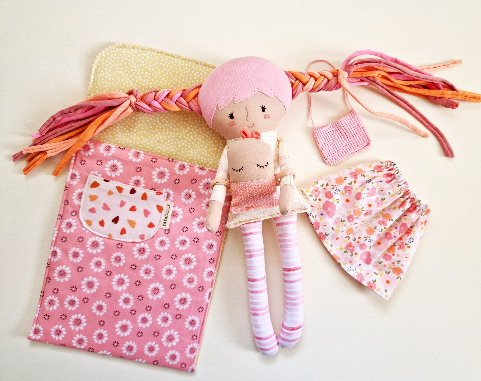 Dress up doll with baby in sleeping bag
