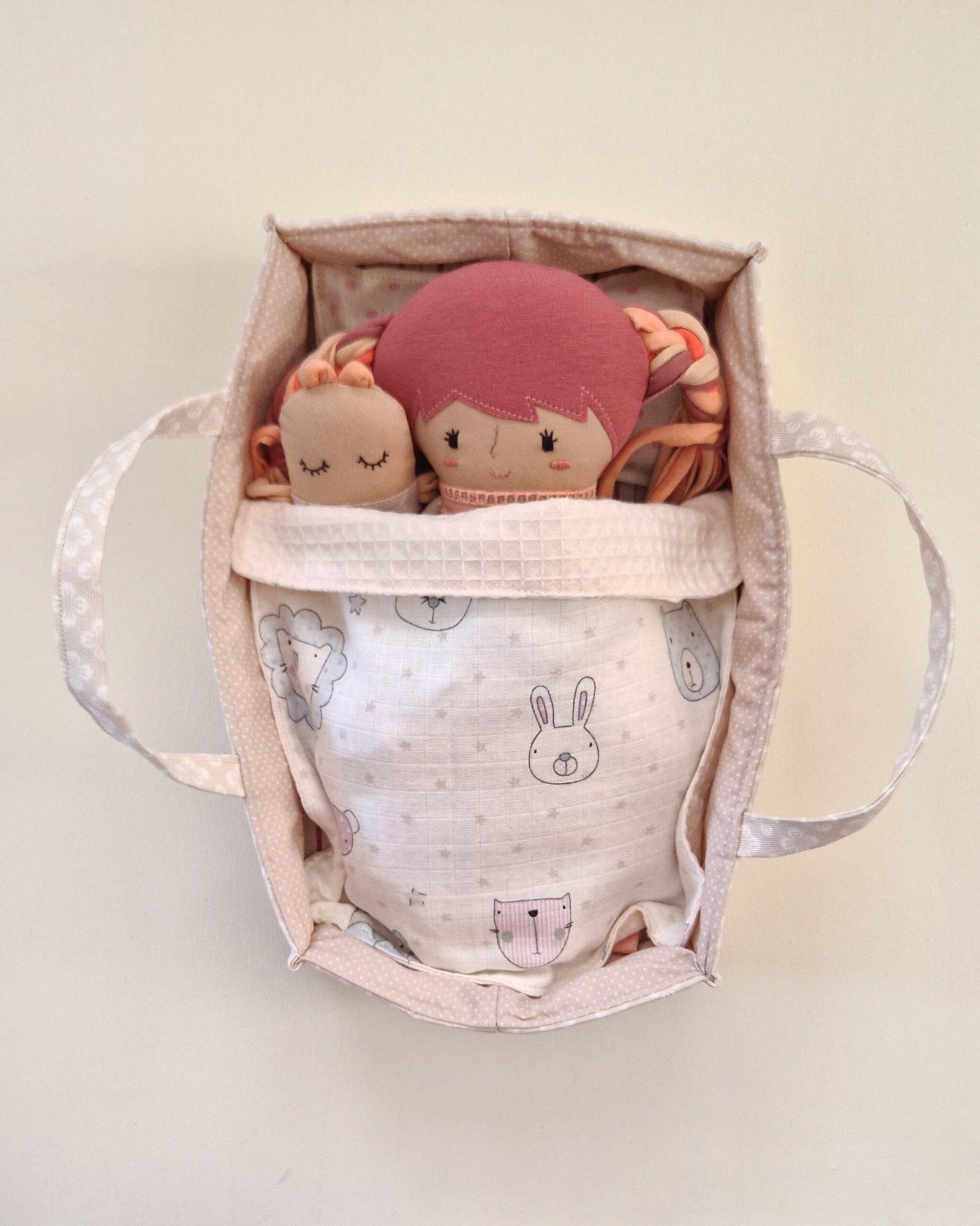 Portable bed for a fabric doll with bedding and accessories