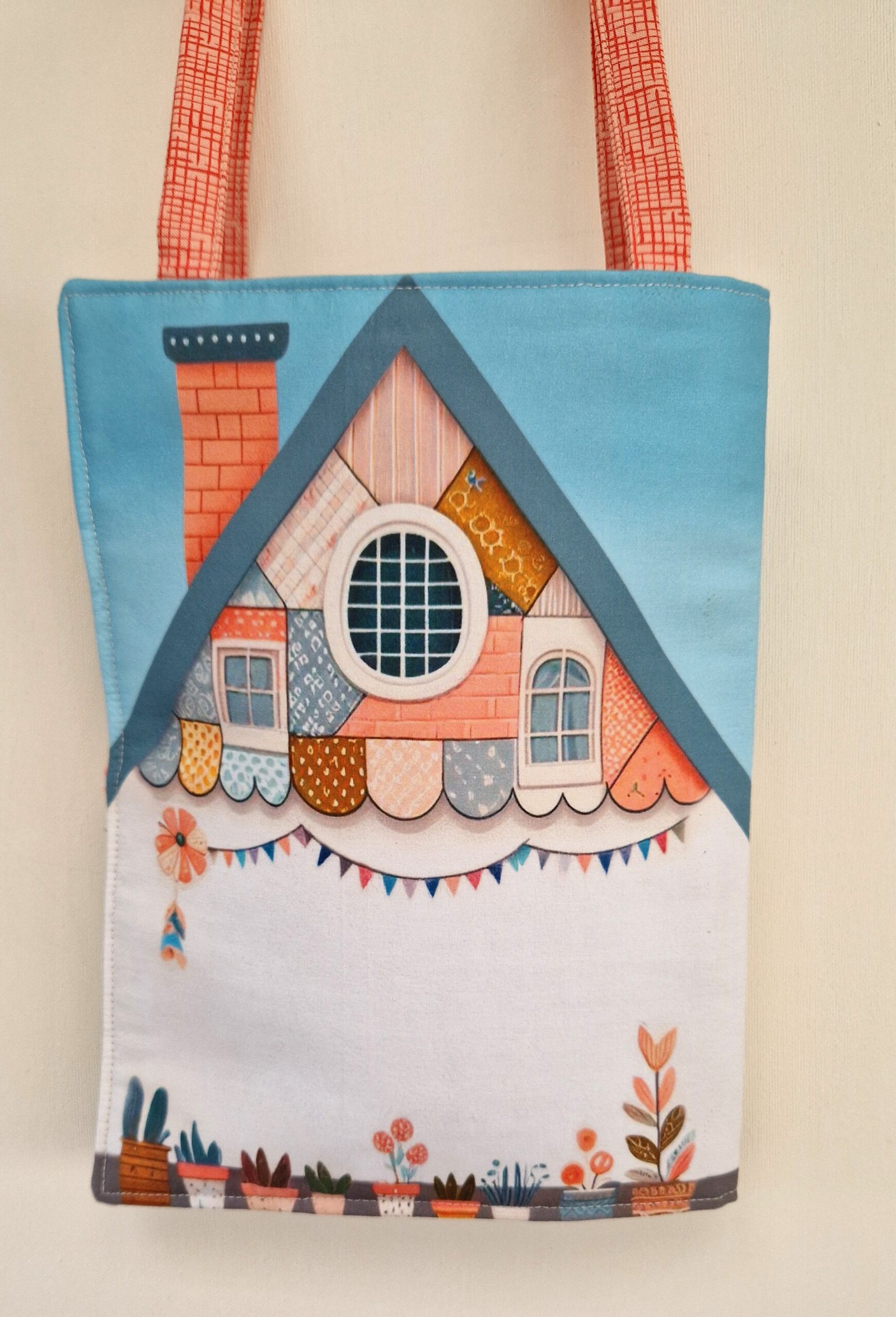 Children's activity doll with a house that transforms into a carrying bag