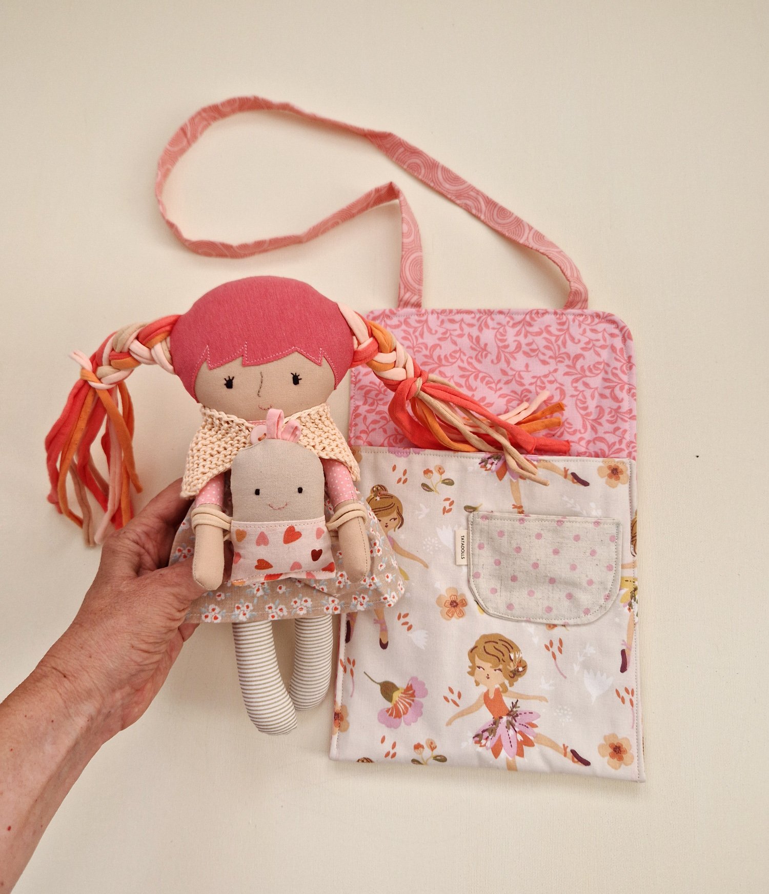 Play doll with colorful hair and a fabric bag with pockets