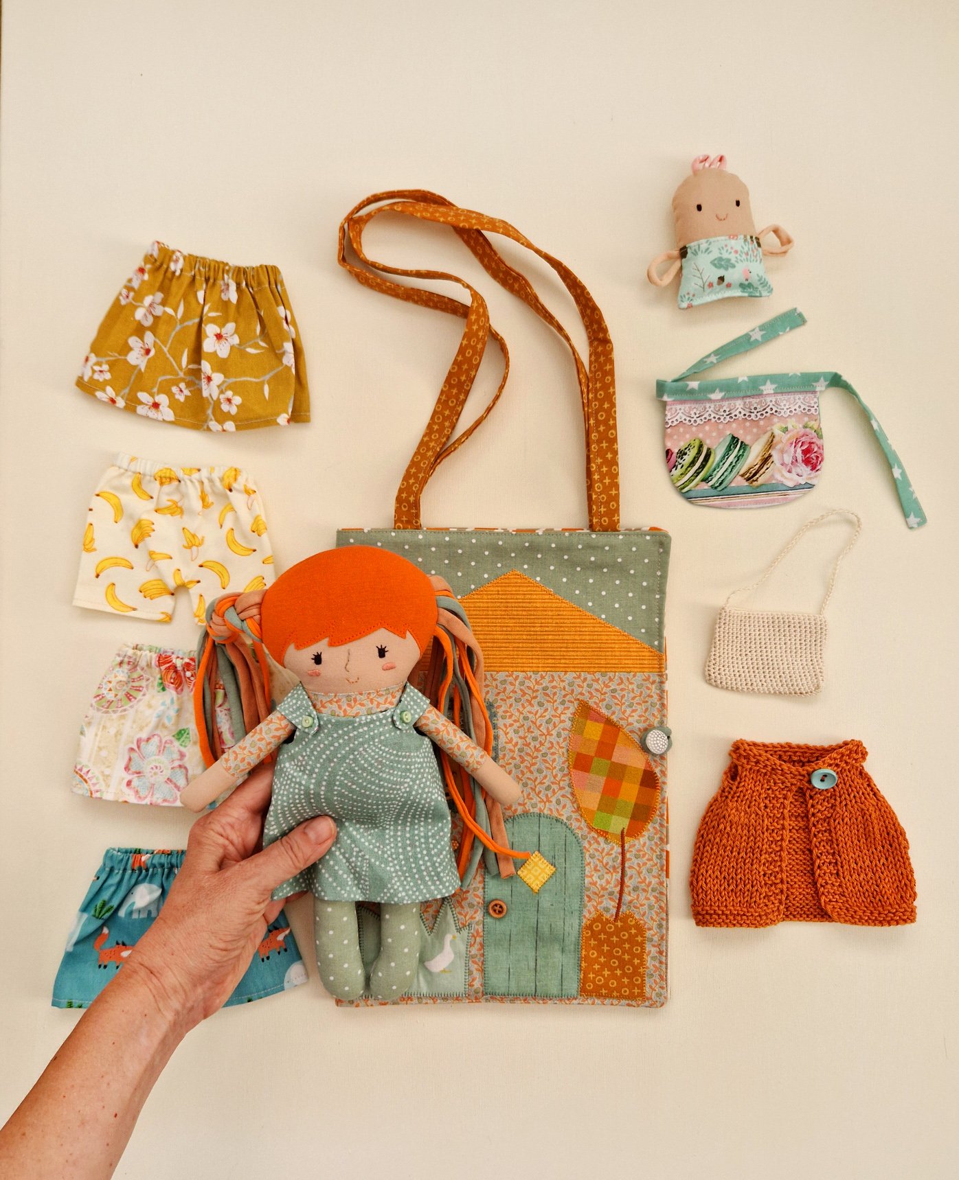 Handmade play doll with a portable fabric house