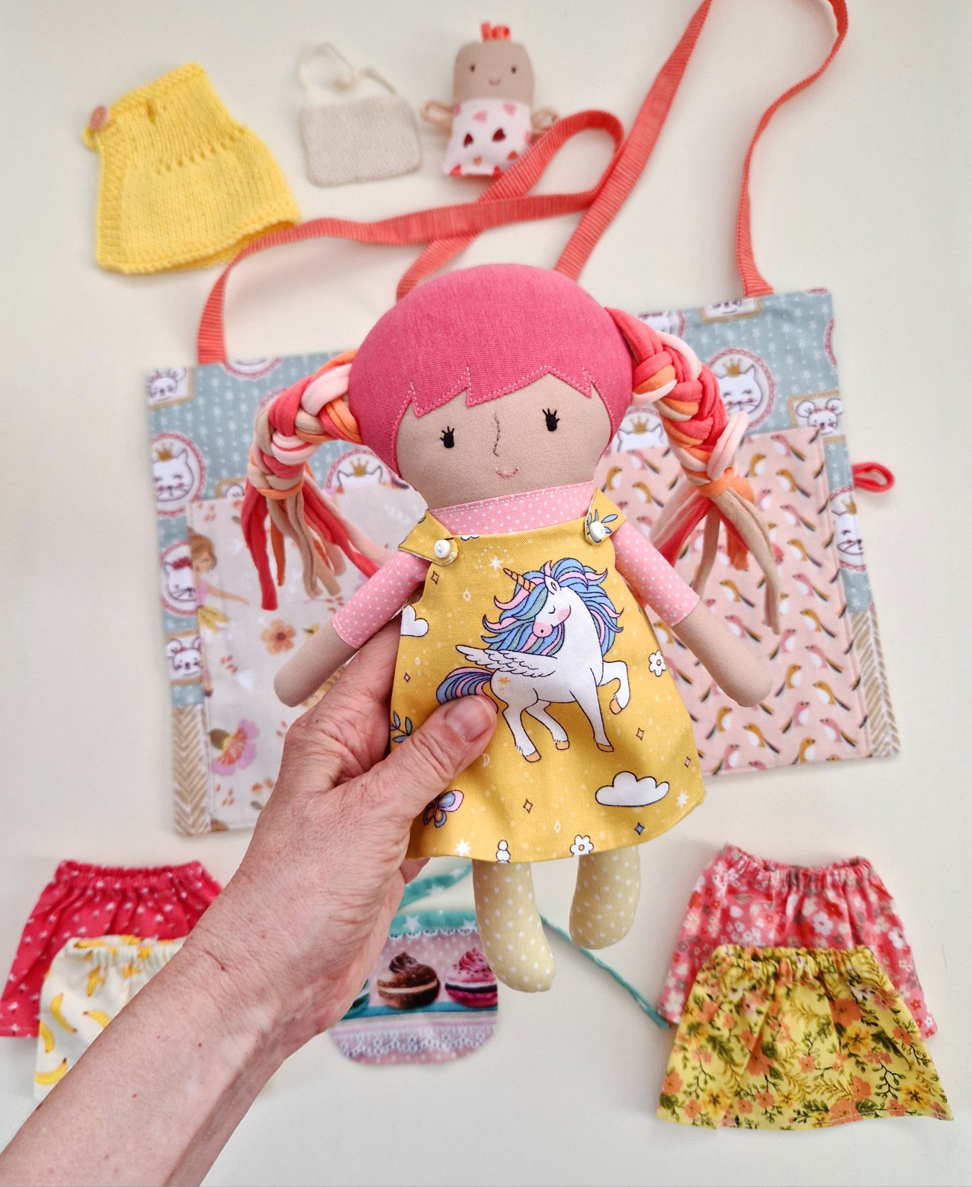 Portable fabric doll house with clothes and play accessories