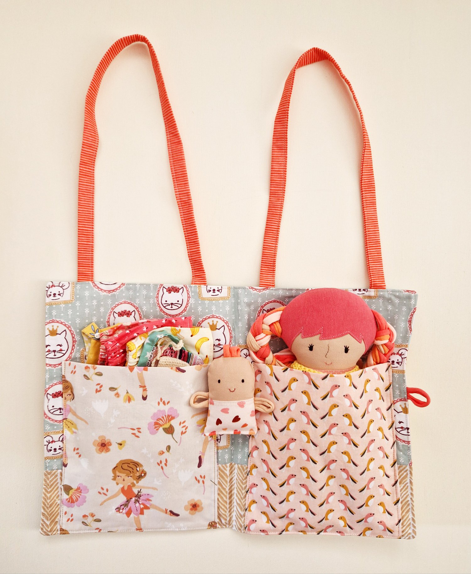Fabric developmental play set with a doll and portable house