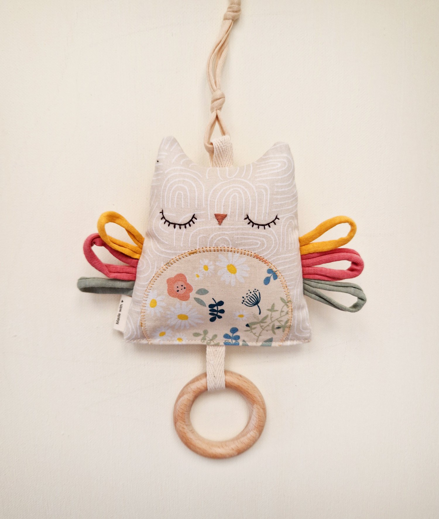 Double-sided baby owl toy with colorful ribbons and wooden teething ring