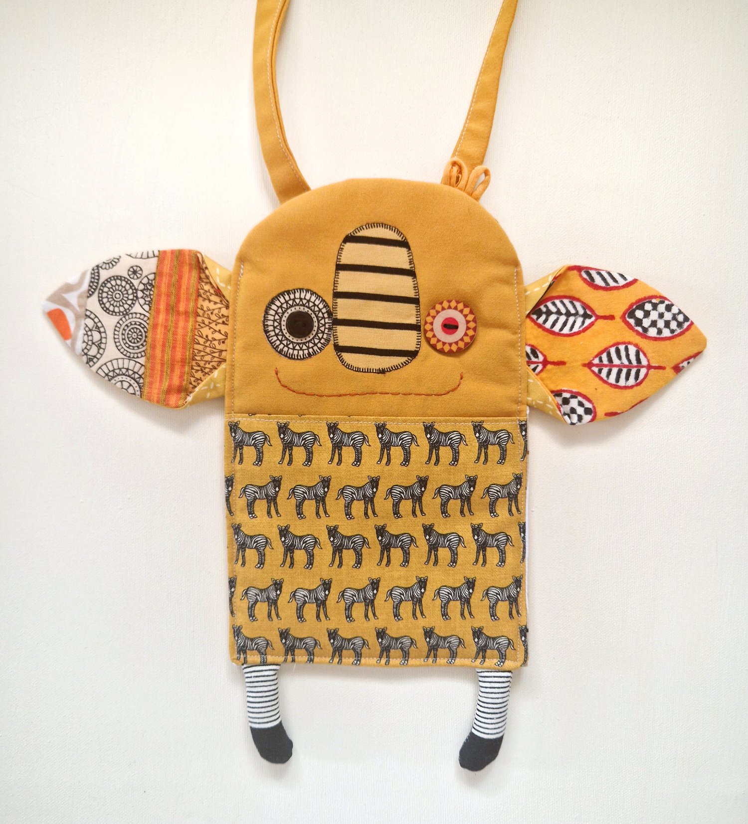 Handmade textile shoulder bag with zebra pattern, colorful details and long strap