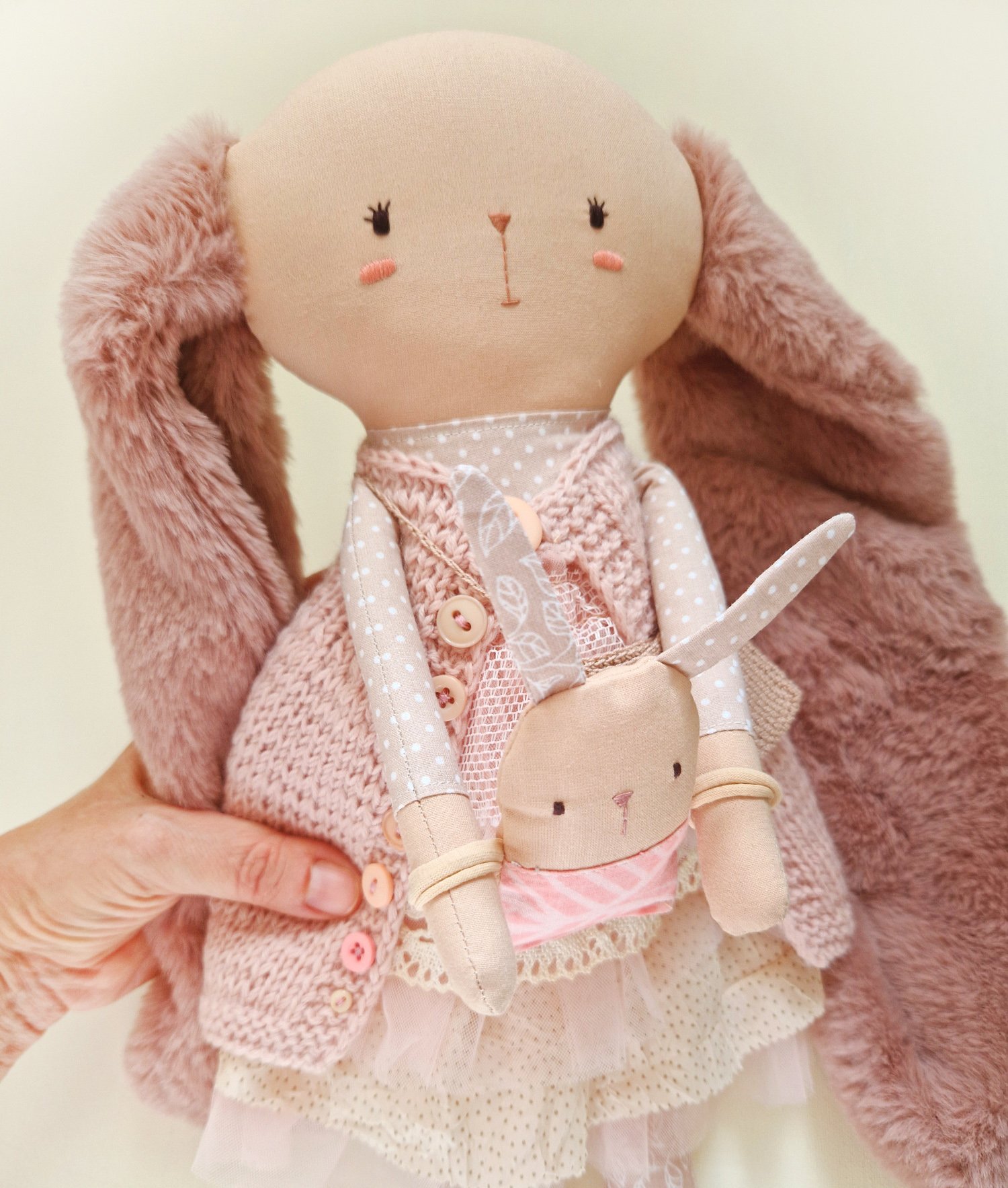 Boho style bunny mom with a baby in her arms, sold with a fabric swing