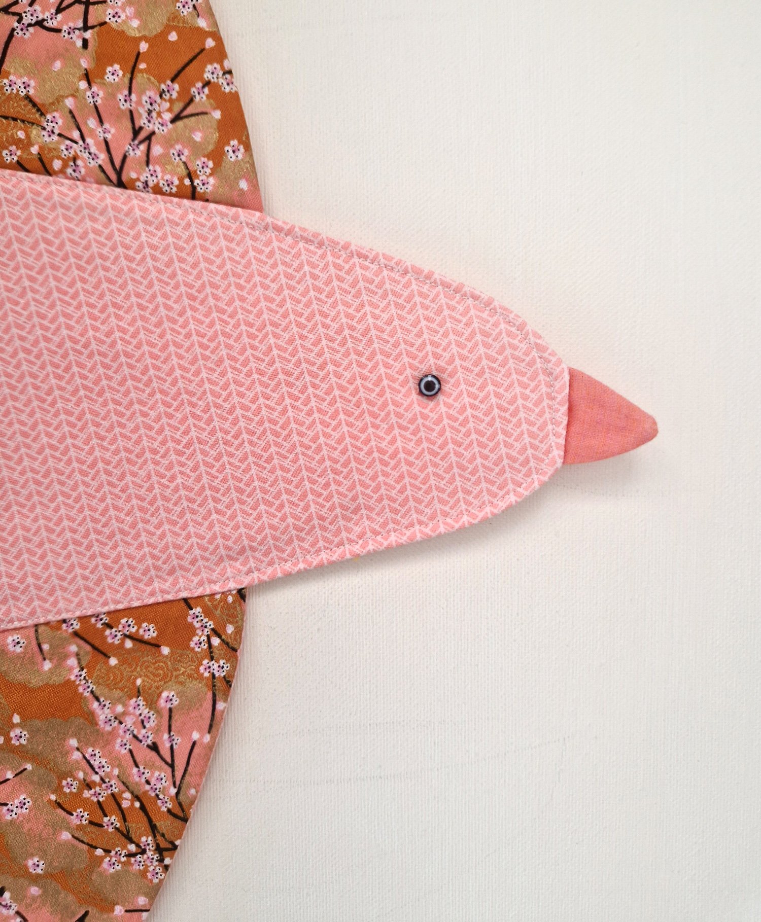Handmade Japanese style bird wall hanging with pink and orange cherry blossom fabrics