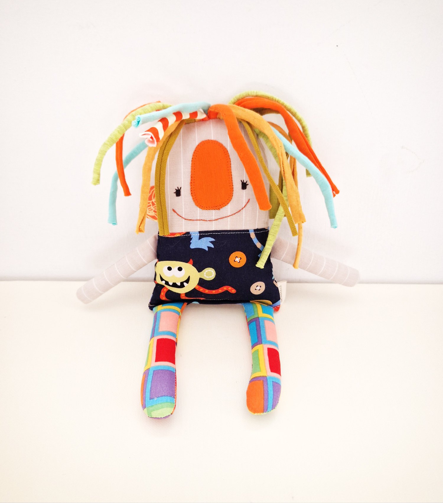 Original handmade fabric doll with a whimsical monster print and bright mismatched textile details